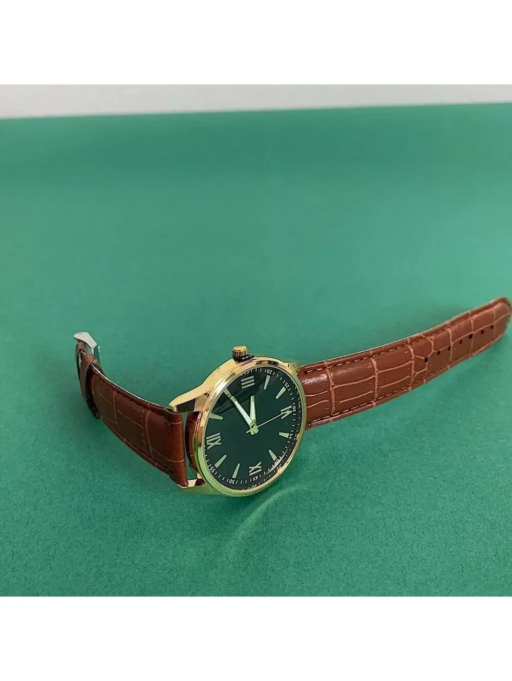 Minimalistic Black essential vintage style gold and leather style band watch. 9